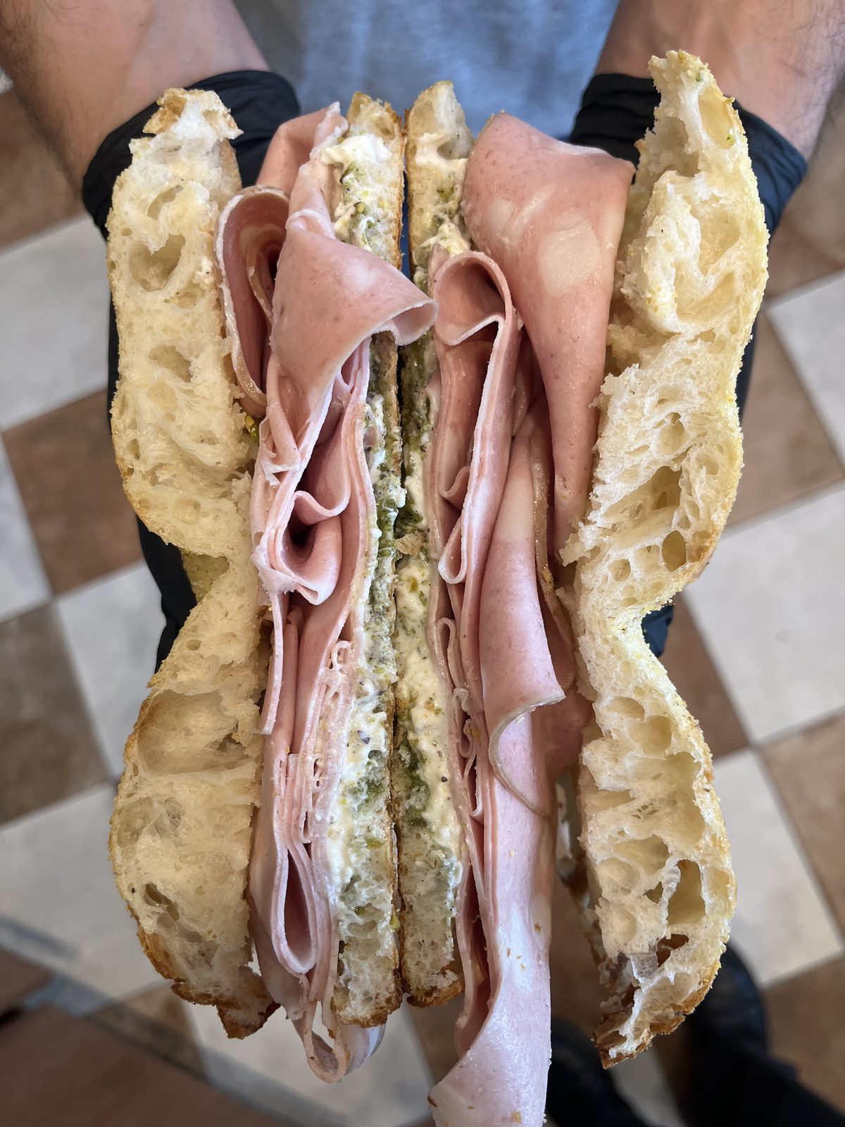 Focaccia filled with mortadella, stracciatella and pistachio cream, a Toscanacci specialty in Pantin